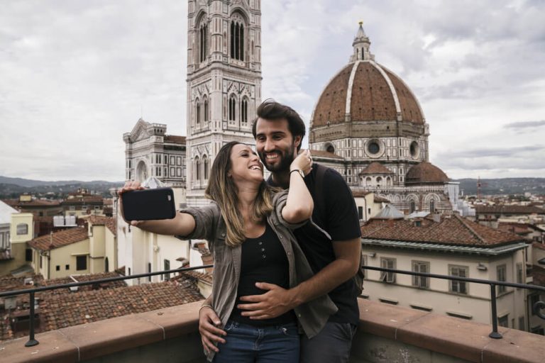 Young lovers visiting Florence in Italy and taking a selfie